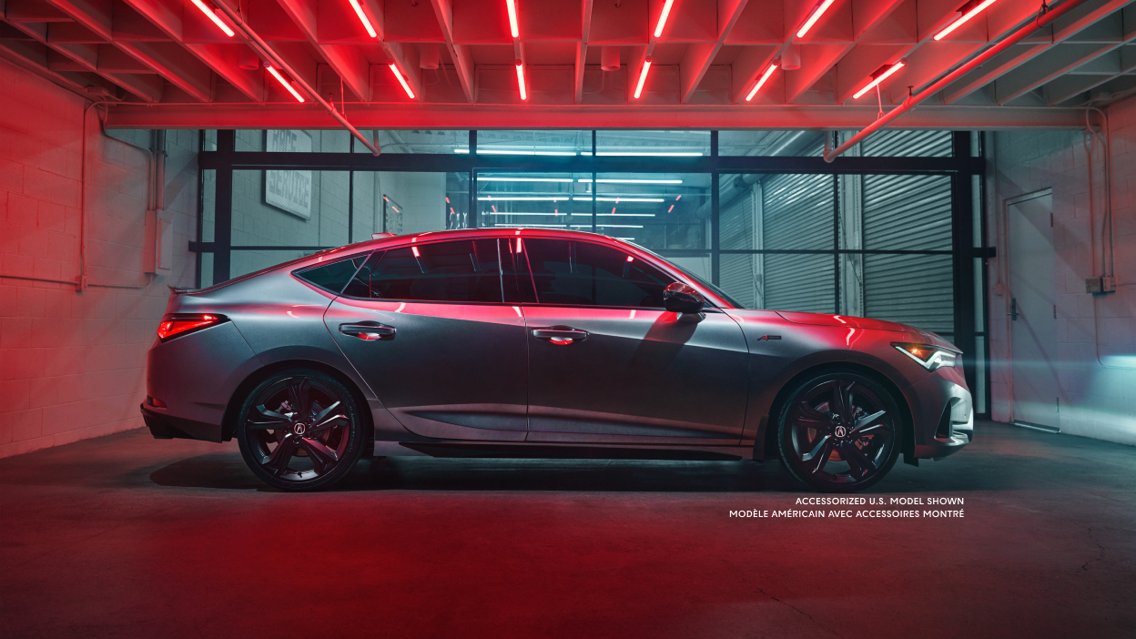 The 2023 Integra right side exterior parked in dark indoors