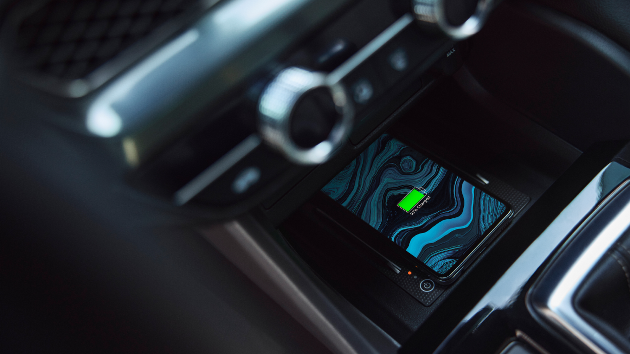 Close-up of 2023 Integra interior wireless charging pad, with smartphone, in 2023 Integra