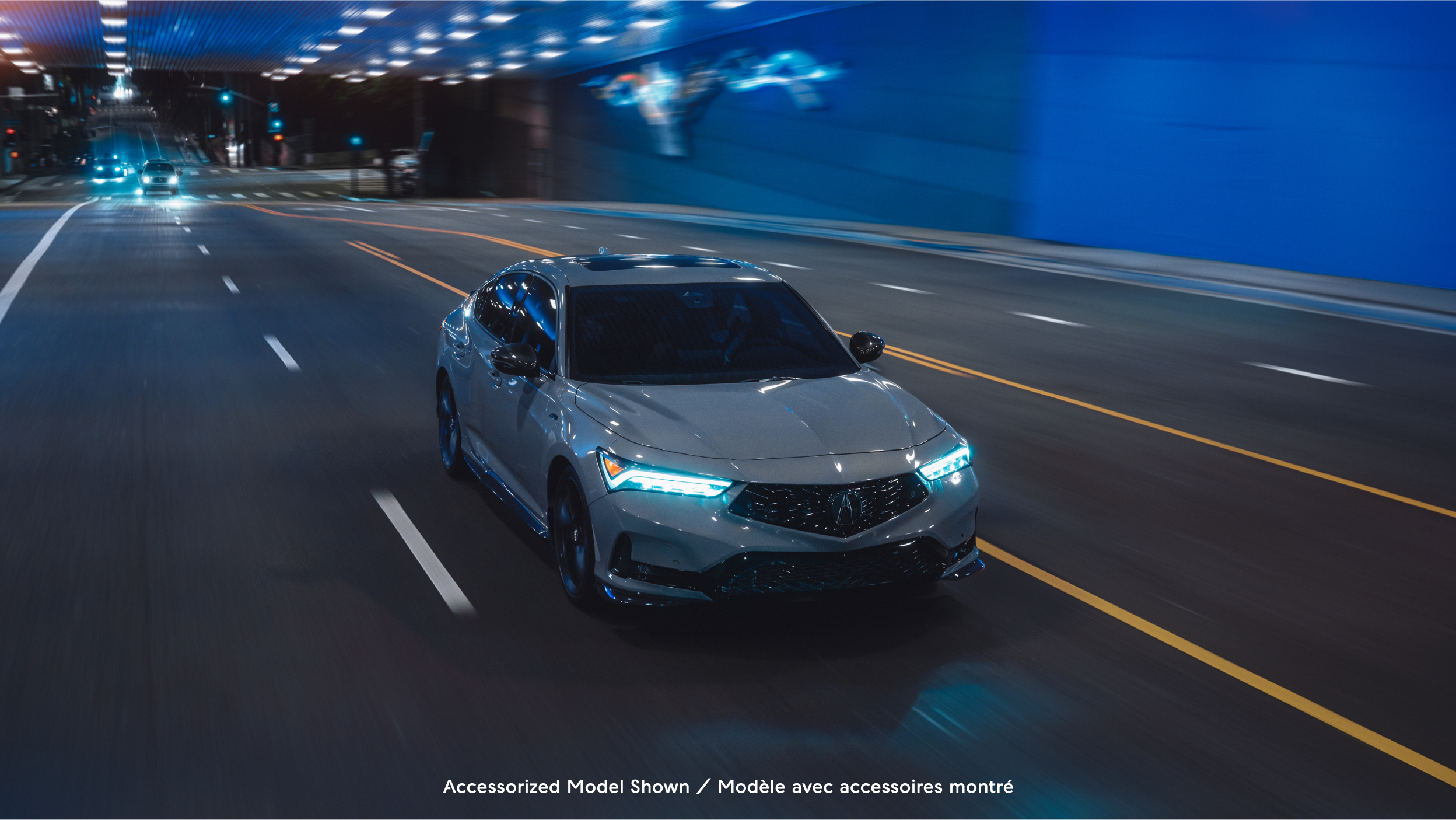 The 2023 Integra right side exterior parked in dark indoors