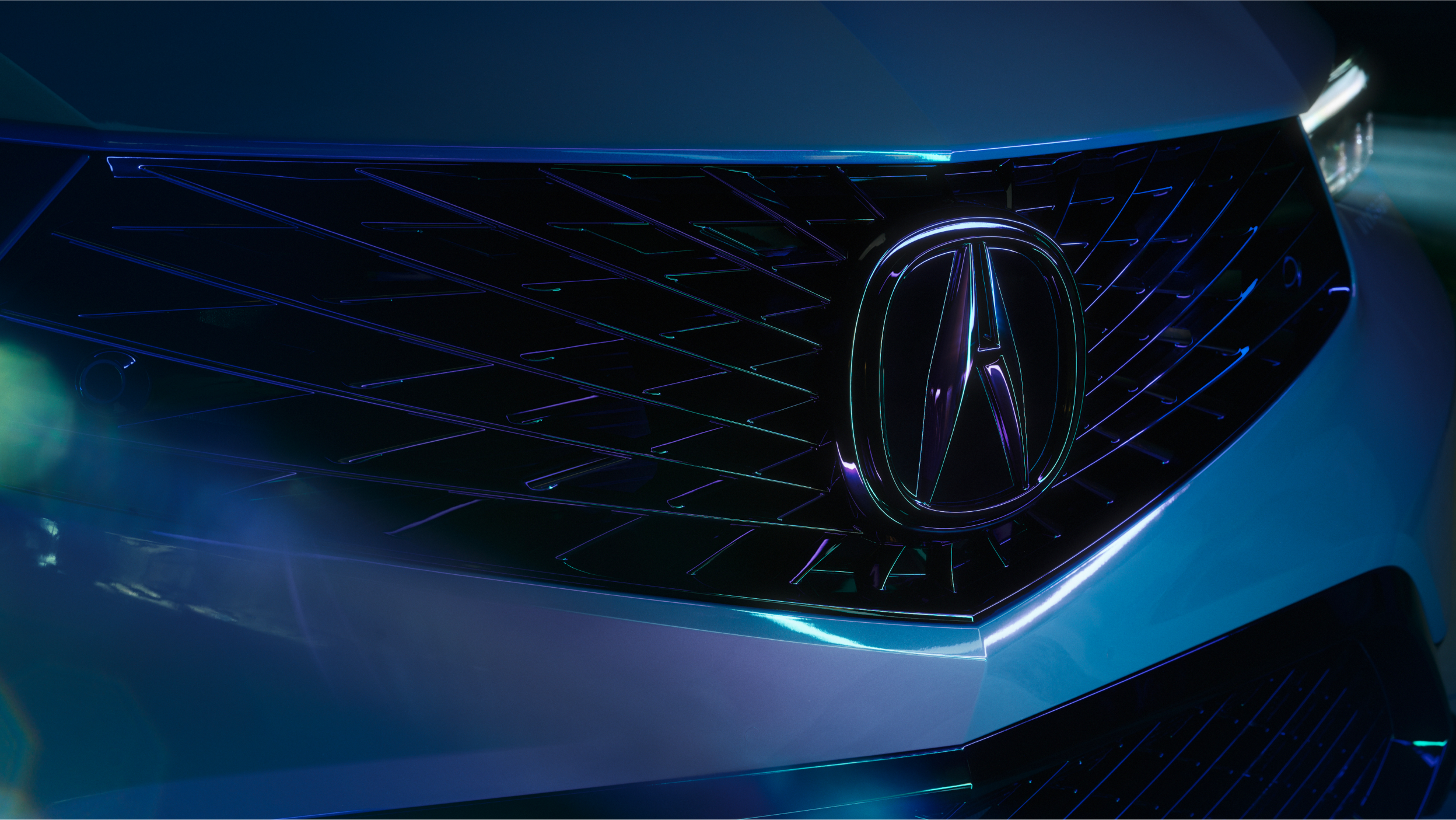 A 2023 Integra front end and side traveling on highway in daylight