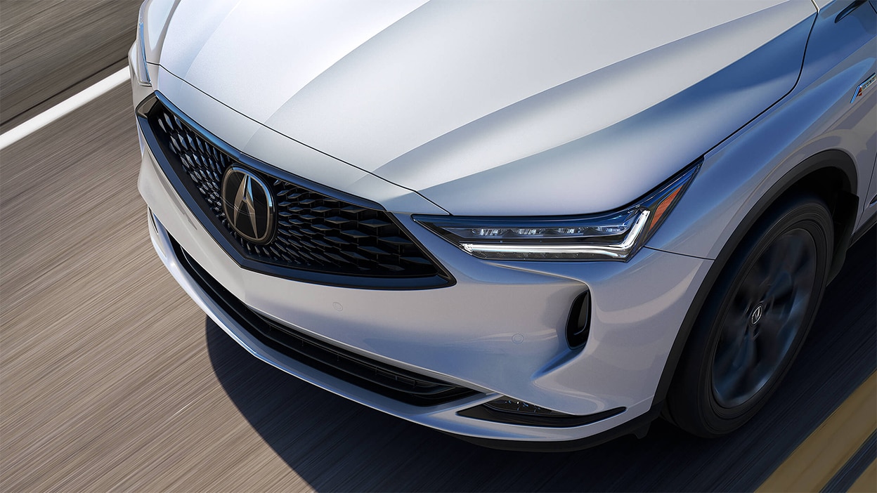 An overhead shot of the hood of a grey Acura MDX.