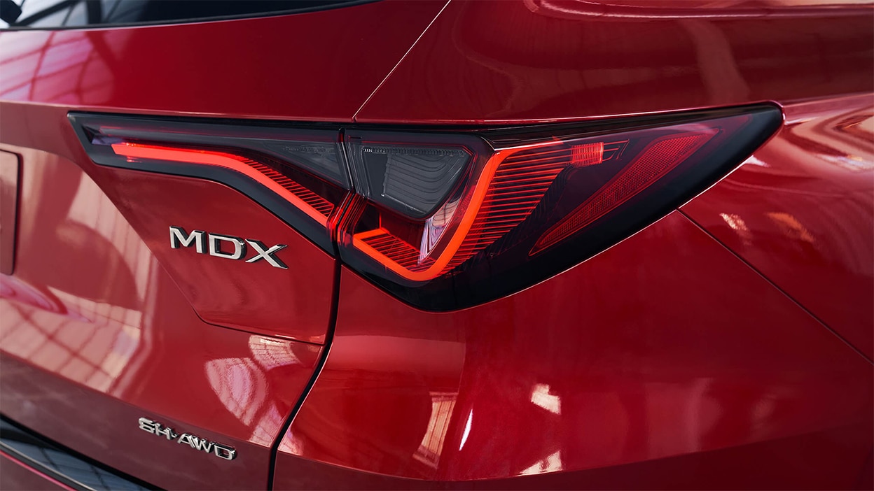 The tail light of a red MDX.