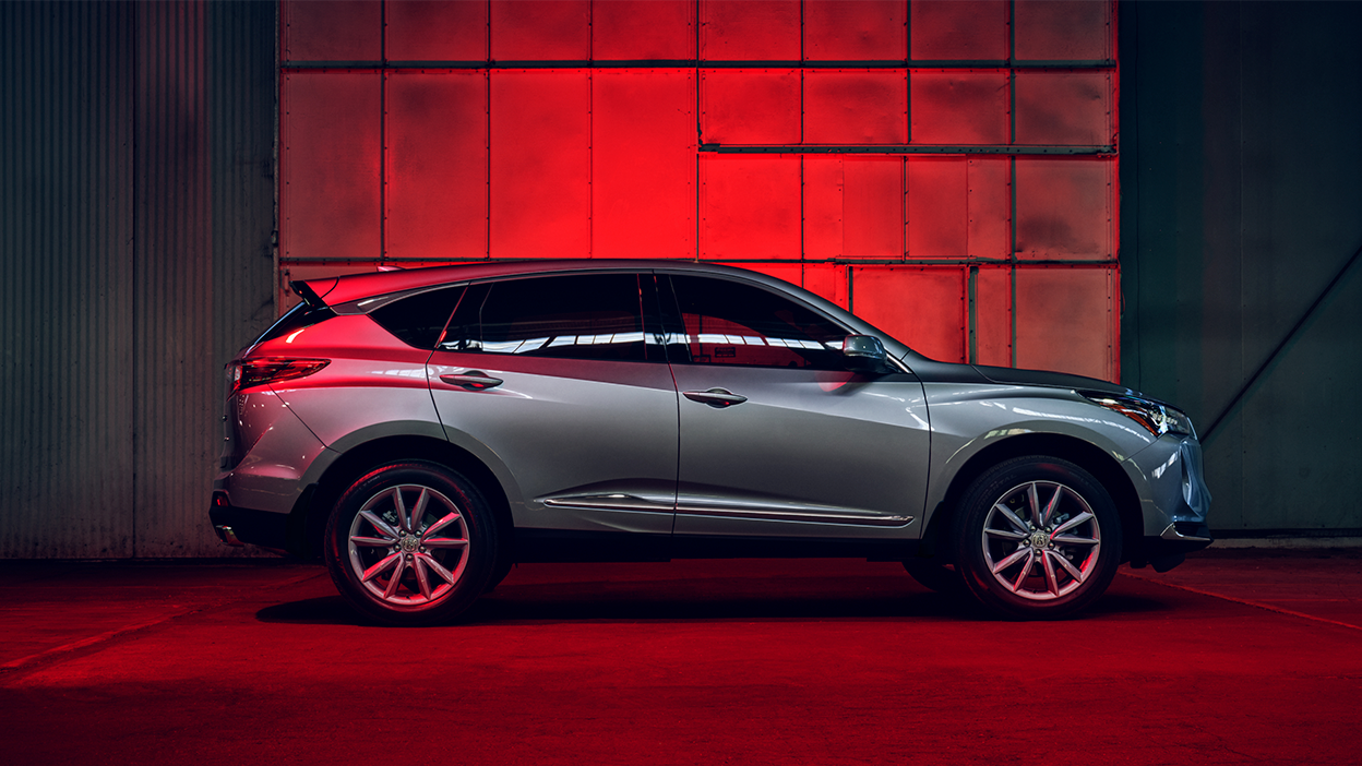 Full profile view of grey RDX in a warehouse with red backlighting. 