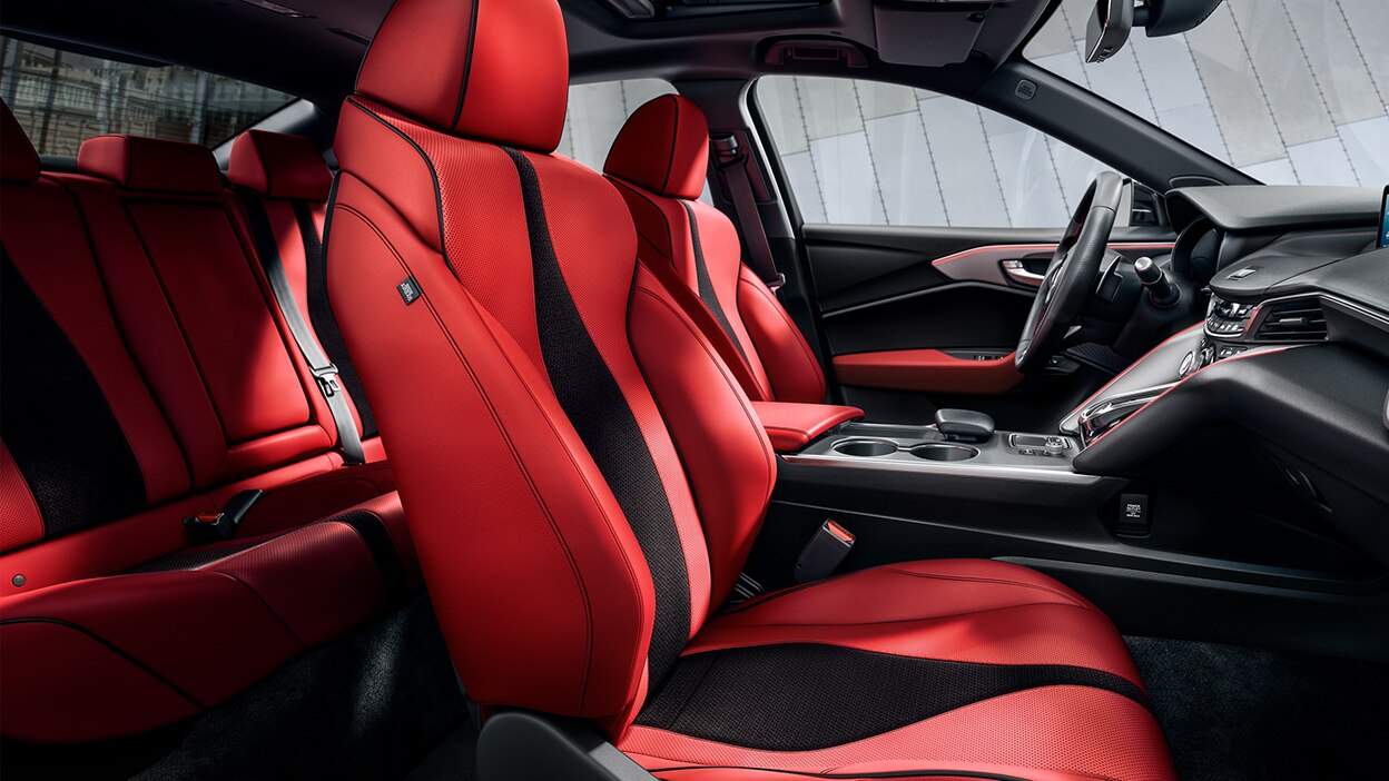 The red and black seats inside a TLX.