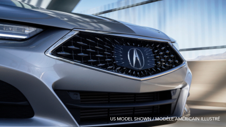 A close-up of the Diamond Pentagon Grille on a grey TLX.