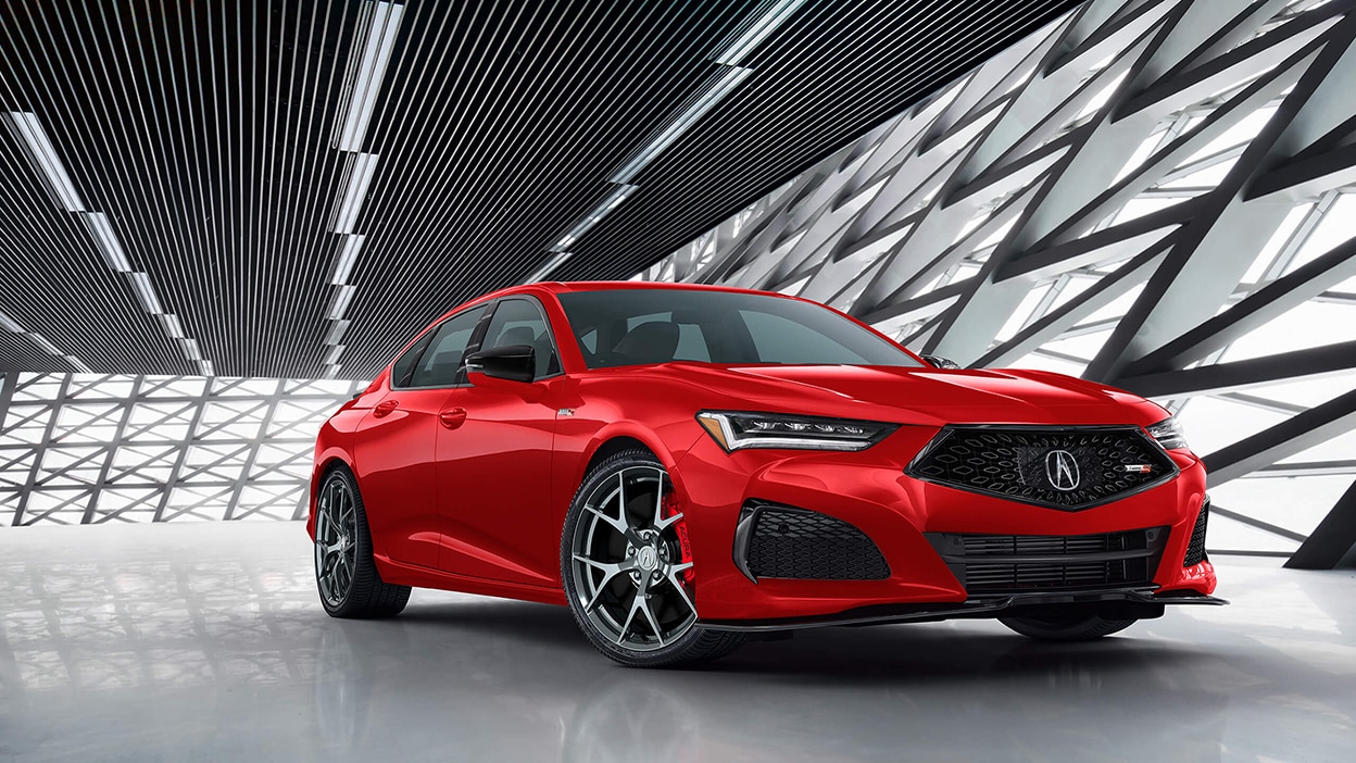 A red TLX parked inside a brightly-lit, stylish building.