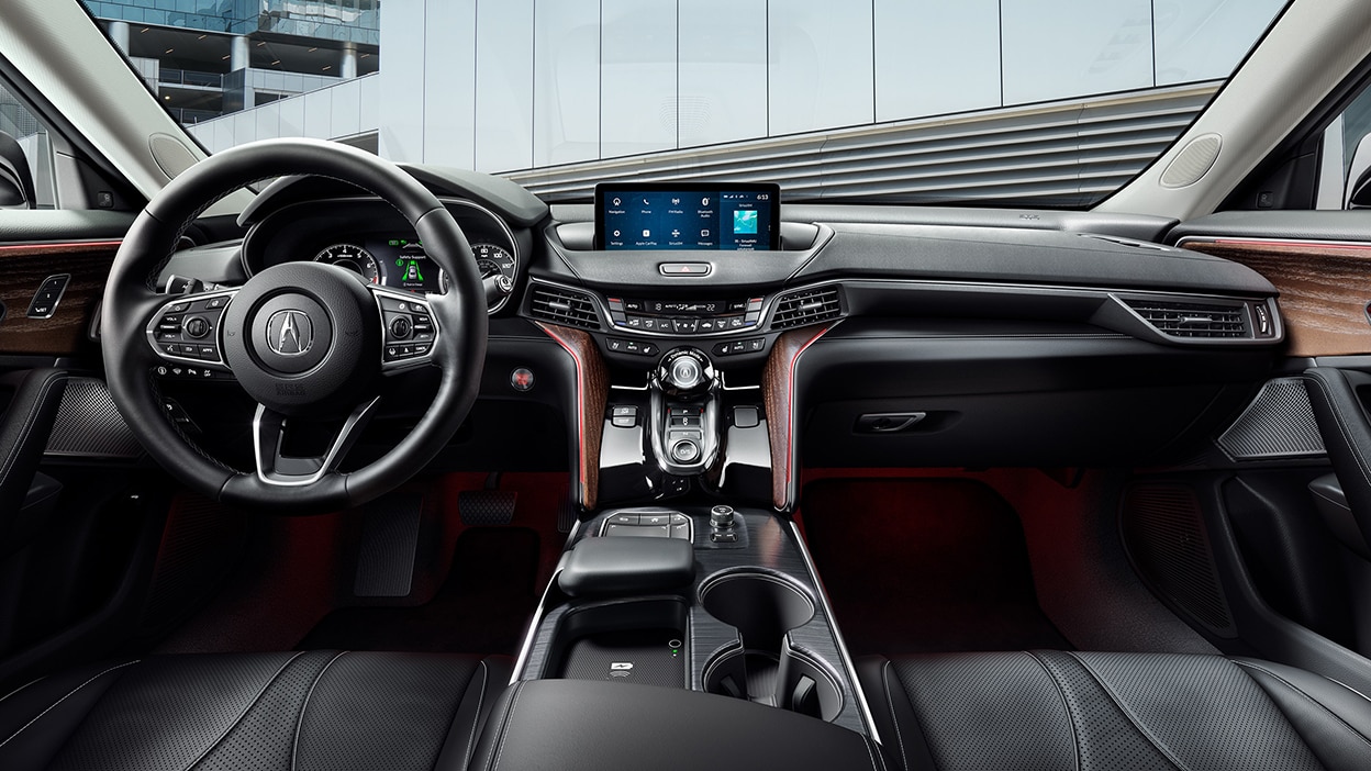 The cockpit of a TLX, while parked outside an office building.