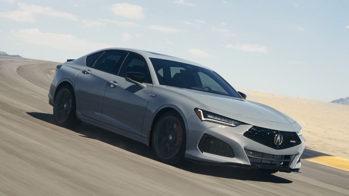 3/4 front side view of grey TLX Type S taking turn on desert racetrack.