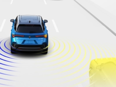 Digital rendering, where everything is white except for the ZDX. Wide rear view of blue ZDX driving on road. Yellow sensor lines detect the car in its blindspot.