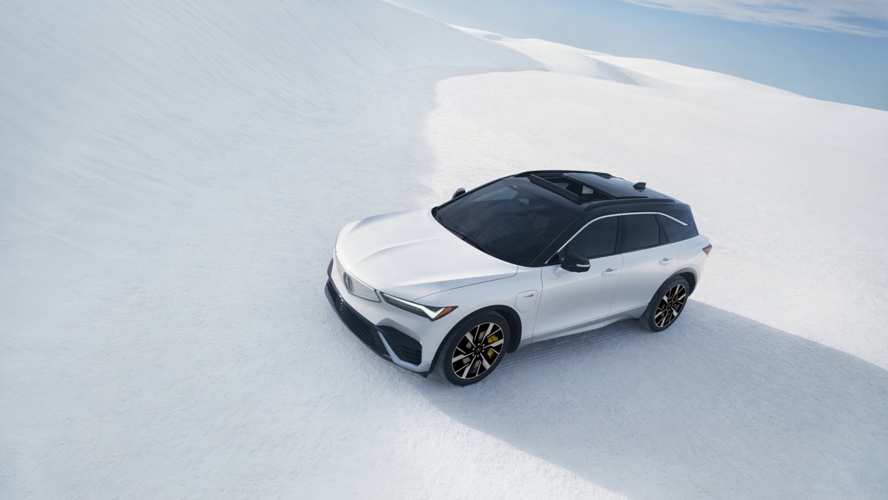 3/4 bird’s eye front view of a white ZDX parked on a salt flat.