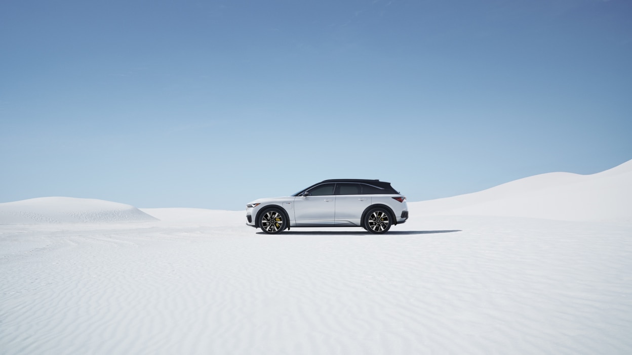 Extreme wide view side view of white ZDX parked on salt flat.
