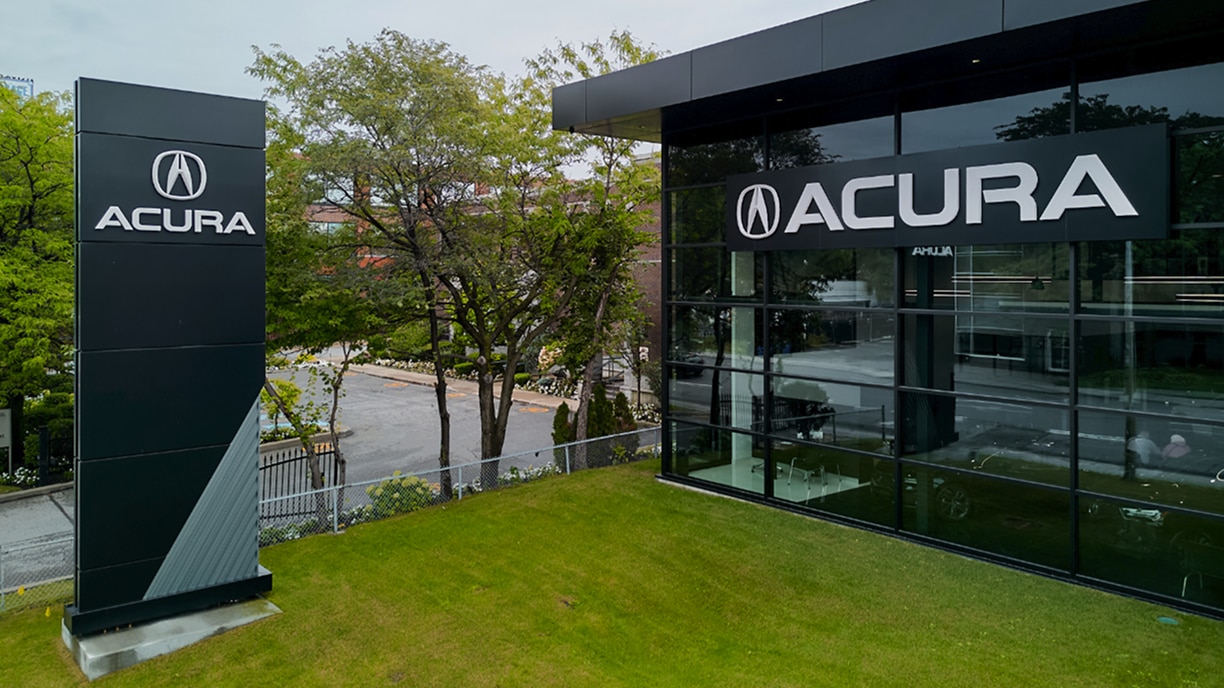 Exterior view of an Acura dealership building.