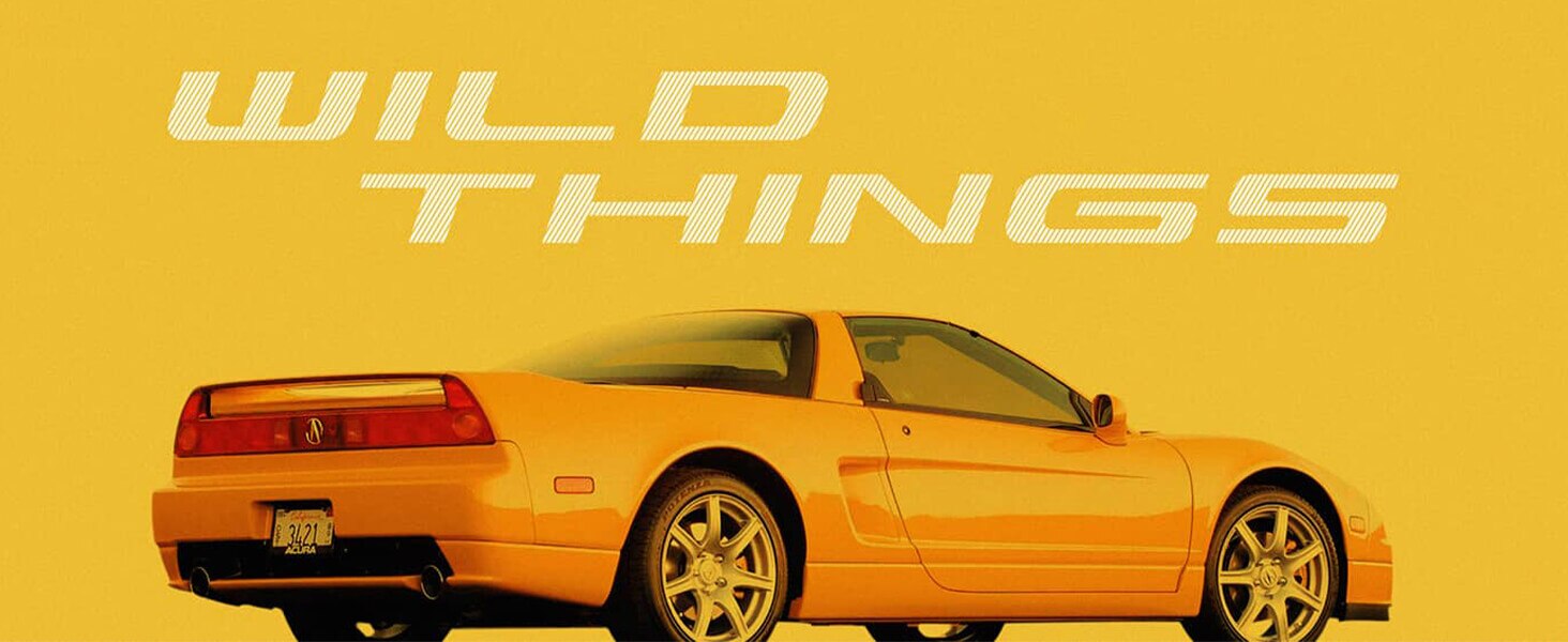 Side view of yellow 1989 Acura NSX. / Vue latérale de l’Acura NSX 1989 jaune.