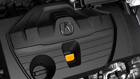 Close-up view of the engine cover with silver Acura logo on top. // Vue rapprochée du capot moteur avec le logo Acura argenté sur le dessus.