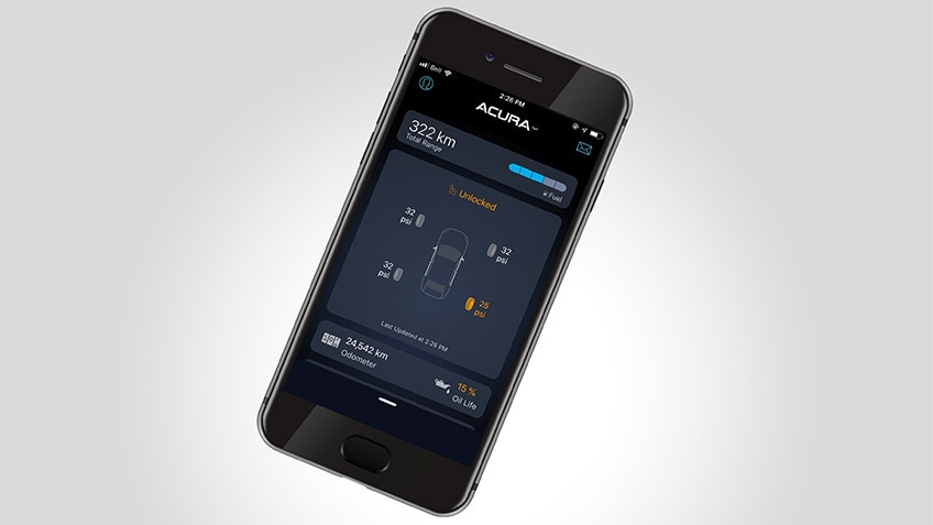 Top-down shot of a black smart phone on a white surface, displaying the AcuraLink™ app on screen./ // Plan de haut en bas d'un téléphone intelligent noir sur une surface blanche, affichant l'application AcuraLinkMC à l'écran.